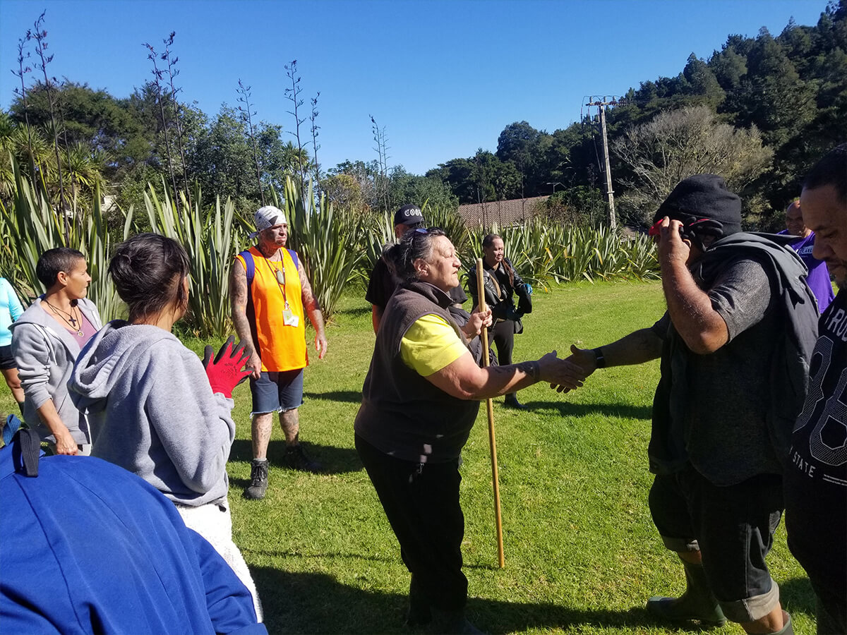 Community circle outdoors at the start of an environmental course